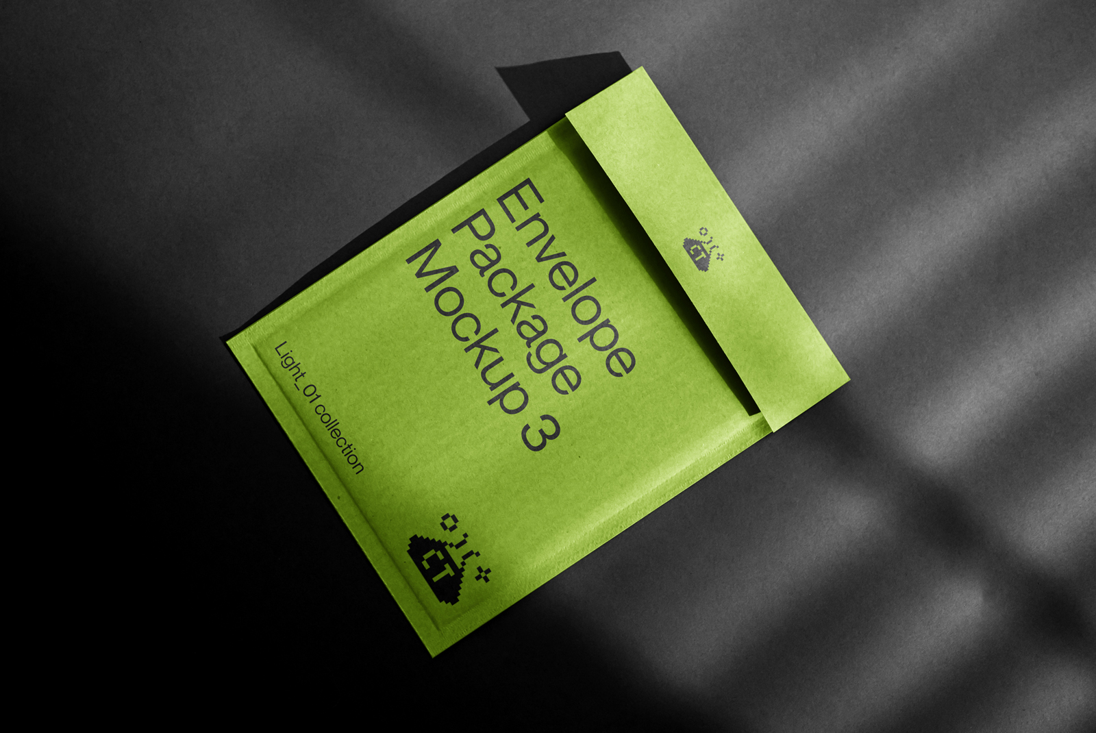 Professional envelope packaging mockup in green with elegant shadows on a dark background for design presentation.